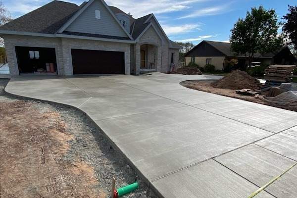 Wide concrete driveway with cut control joints